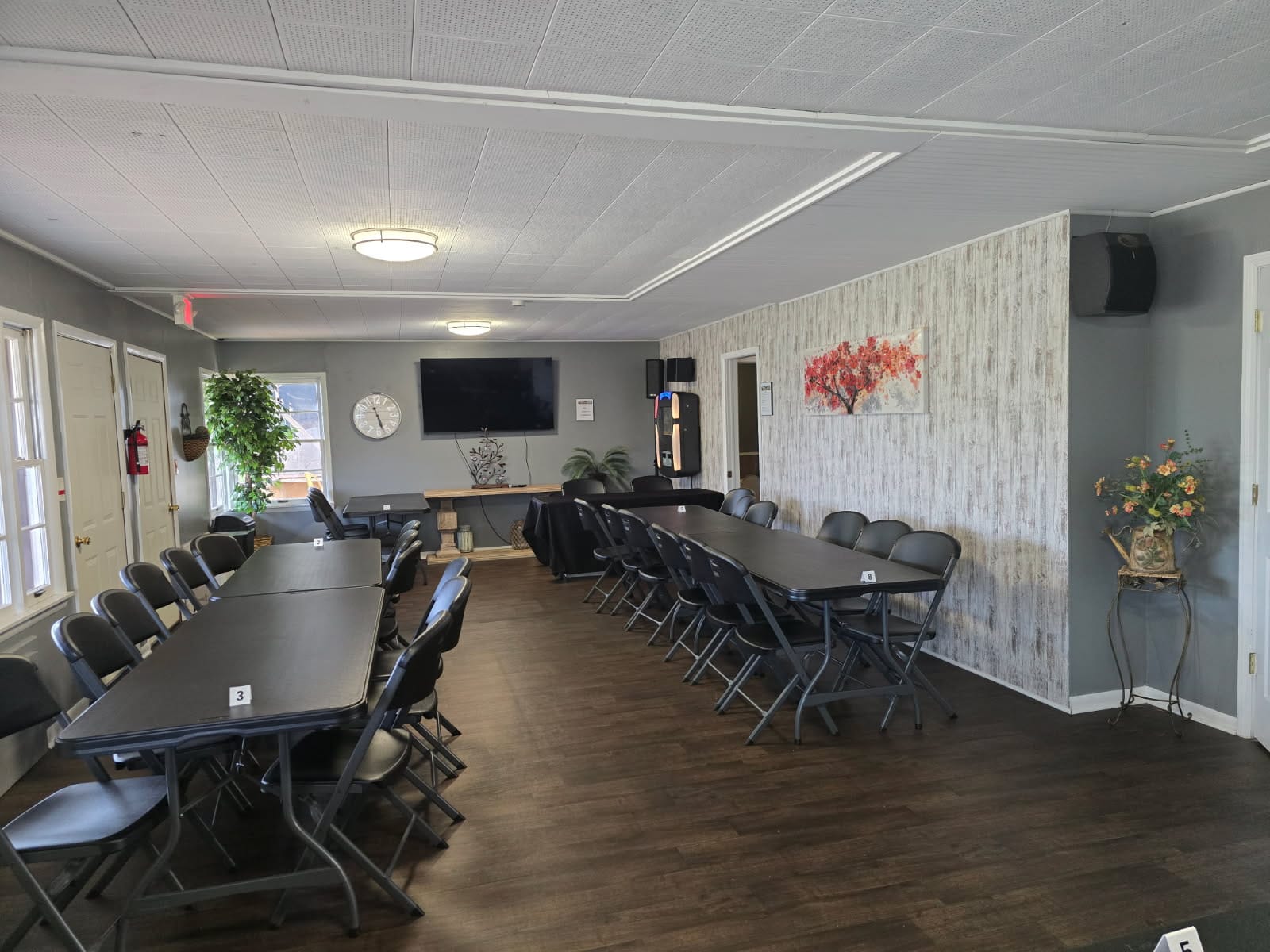 Indoor lounge and event room at Eagles Nest with long tables set up for a group